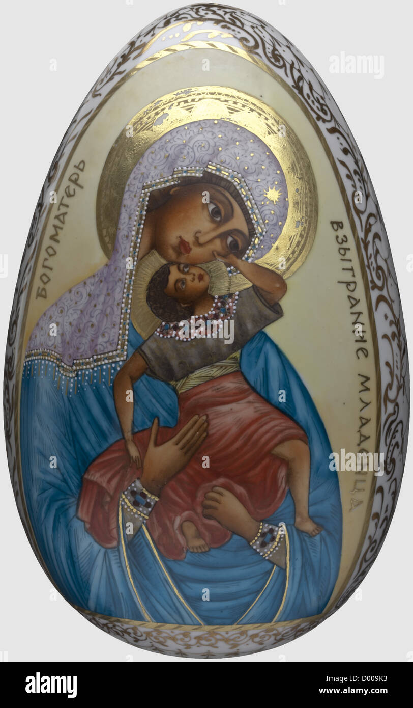 Large porcelain Easter egg, Russia circa 1910. The obverse adorned by a hand-painted portrayal of the Virgin Mother with Child and the Cyrilic inscription 'Bogomater - Vzygranie Mladentsa' in gold, the reverse showing the Cyrillic characters 'XB' with flowers and scales in gold painting on white ground. Height 21 cm, historic, historical, people, 1910s, 20th century, object, objects, stills, clipping, clippings, cut out, cut-out, cut-outs, Additional-Rights-Clearences-Not Available Stock Photo