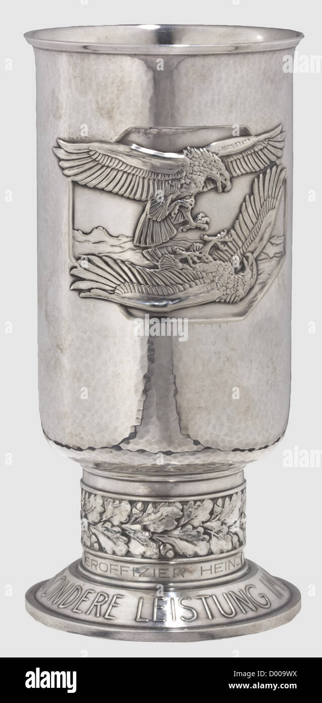 A Goblet of Honour for Outstanding Achievement in the Air War,to the aerial gunner Unteroffizier Heinz Knisse. 2nd issue in fine silver-plated alpaca,punched 'Joh. Wagner & Sohn' at the bottom. Inscription ring engraved 'Unteroffizier Heinz Knisse am 8.5.42'. Height 20.7 cm(Nie 7.08.02 2). In very fine condition,historic,historical,1930s,1930s,20th century,awards,award,German Reich,Third Reich,Nazi era,National Socialism,object,objects,stills,medal,decoration,medals,decorations,clipping,cut out,cut-out,cut-outs,honor,honour,National ,Additional-Rights-Clearences-Not Available Stock Photo