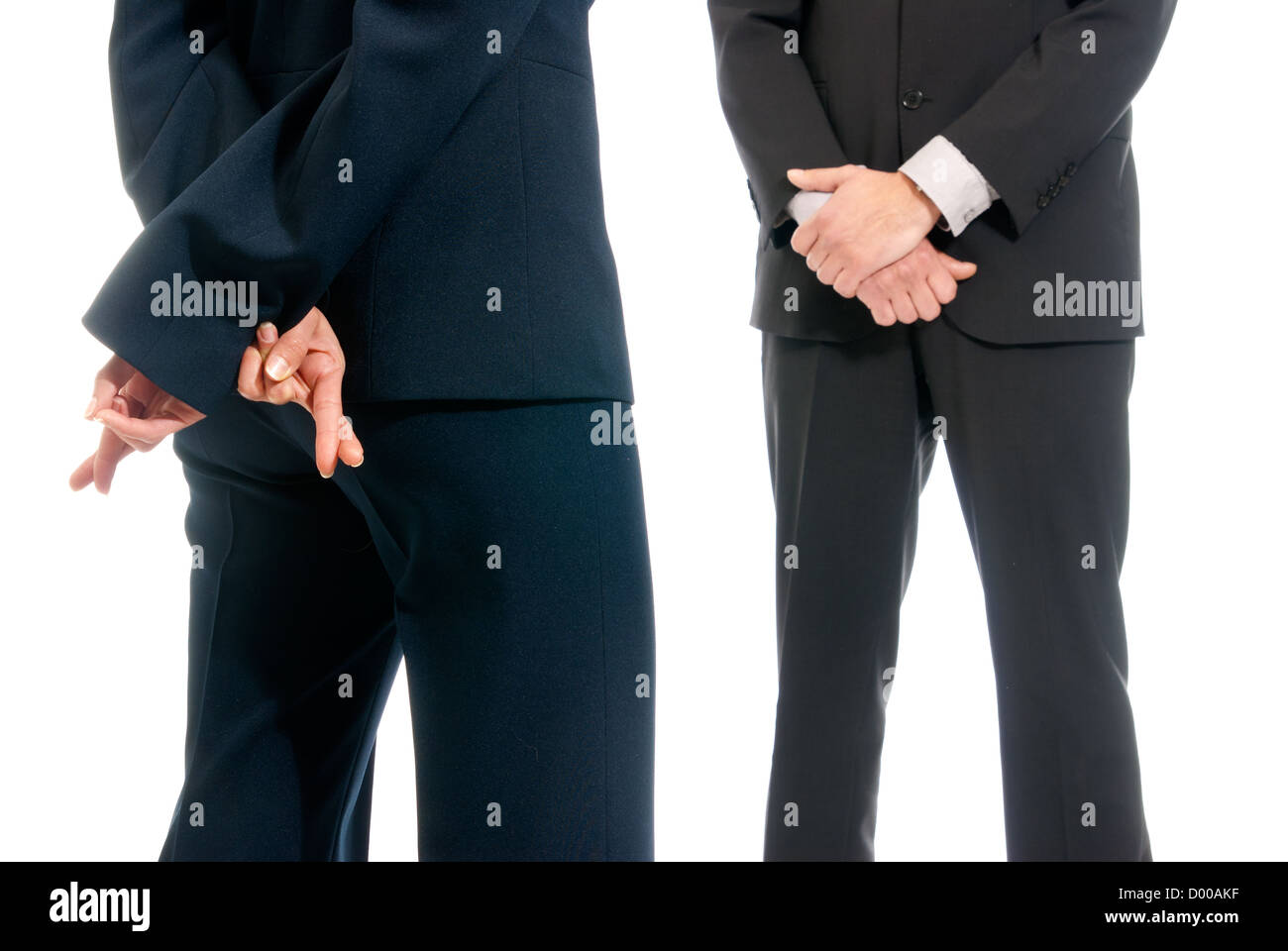 Business concept fingers crossed in front of boss isolated on white background Stock Photo
