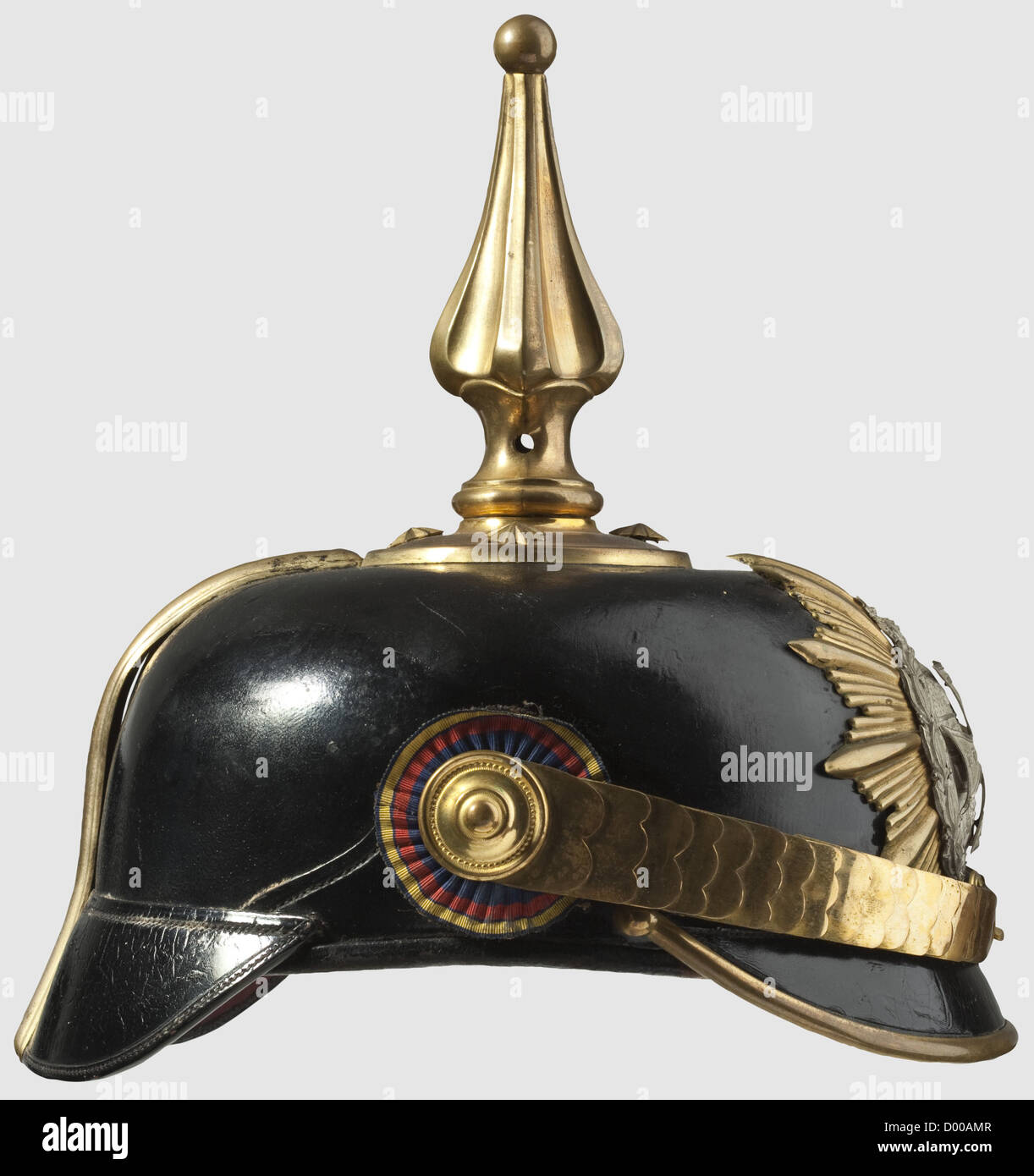 A helmet for officers of the Infantry Reserve or Medical Service,as worn until 1897.Leather skull with gilded mountings.The helmet spike is of the special Mecklenburg pattern with a turn-off ball finial.Silver-plated Mecklenburg arms displayed on the gilded star plate with a superimposed Landwehr cross,so mounted that it may be removed without a trace(no hole in the emblem).Flat metal chinscales.Silk national cockade on the right side.Ribbed silk lining with the owner's name 'Dr.Holm'.Beautifully preserved,rare helmet,historic,historical,19th cen,Additional-Rights-Clearences-Not Available Stock Photo