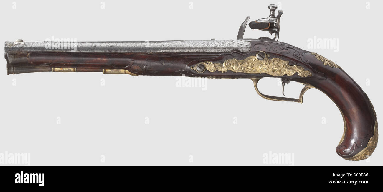 A flintlock pistol,Wenzl Böhm in Eger,circa 1740.Round smooth-bore Damascus barrel in 13.5 mm calibre with midrib and silver 'spider' front sight.The flintlock finely engraved with floral decorations and horsemen,beneath the powder pan signed 'WENZL BÖHM IN EGER'.Carved walnut stock with horn nose.Gilt brass furniture with rocaille decorations and soldiers in relief.Wooden ramrod with horn tip.Length 39 cm.High-quality pistol,except for a small crack underneath the lock as well as two tiny cracks on the forestock in good condition.Wenzl Böhm,Eger,,Additional-Rights-Clearences-Not Available Stock Photo
