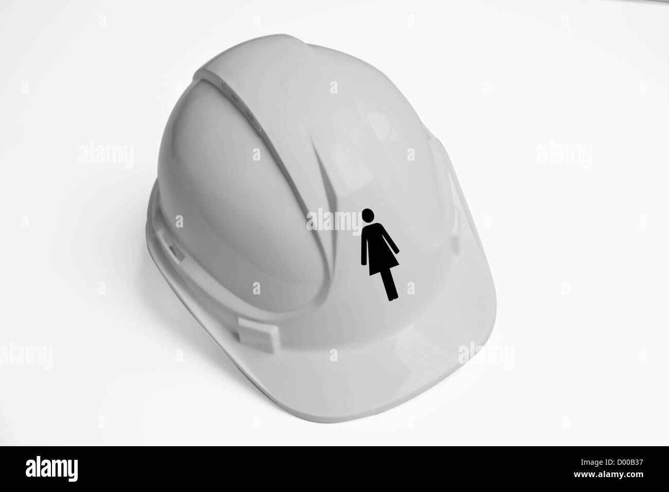 Women's symbol on hard hat against white background Stock Photo