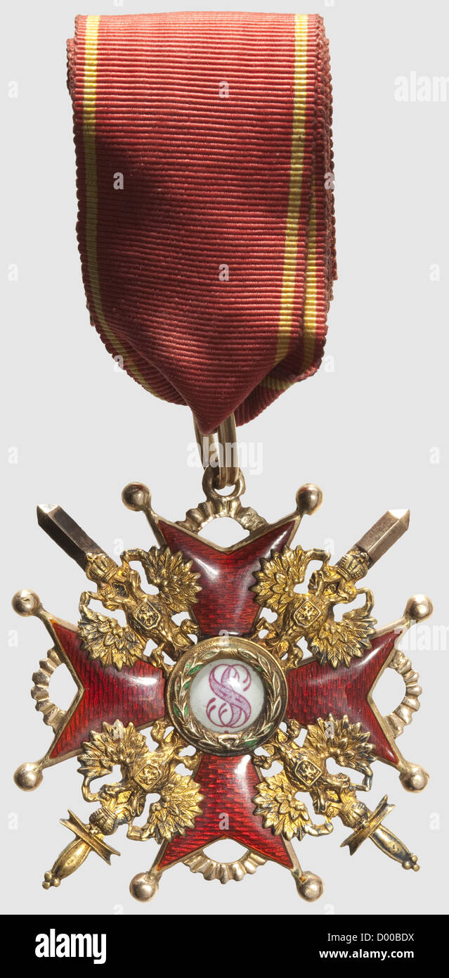 An Order of St. Stanislaus,2nd Class Cross with Swords,Russia circa 1910. In gold and enamel. Cyrillic punch marks on the reverse cross arms 'Eduard' and 'VD' for Varvara Dietwald. The eyelet with mark of fineness for 56 zolotniki,the suspension ring and swords with kokoschnik head punches. Small enamel chips in the medallion wreath. Dimensions 52 x 49 mm,weight 26 g. Old ribbon section,length 31 cm. Good condition,historic,historical,1910s,20th century,medal,decoration,medals,decorations,badge of honour,badge of honor,badges of honour,badges o,Additional-Rights-Clearences-Not Available Stock Photo
