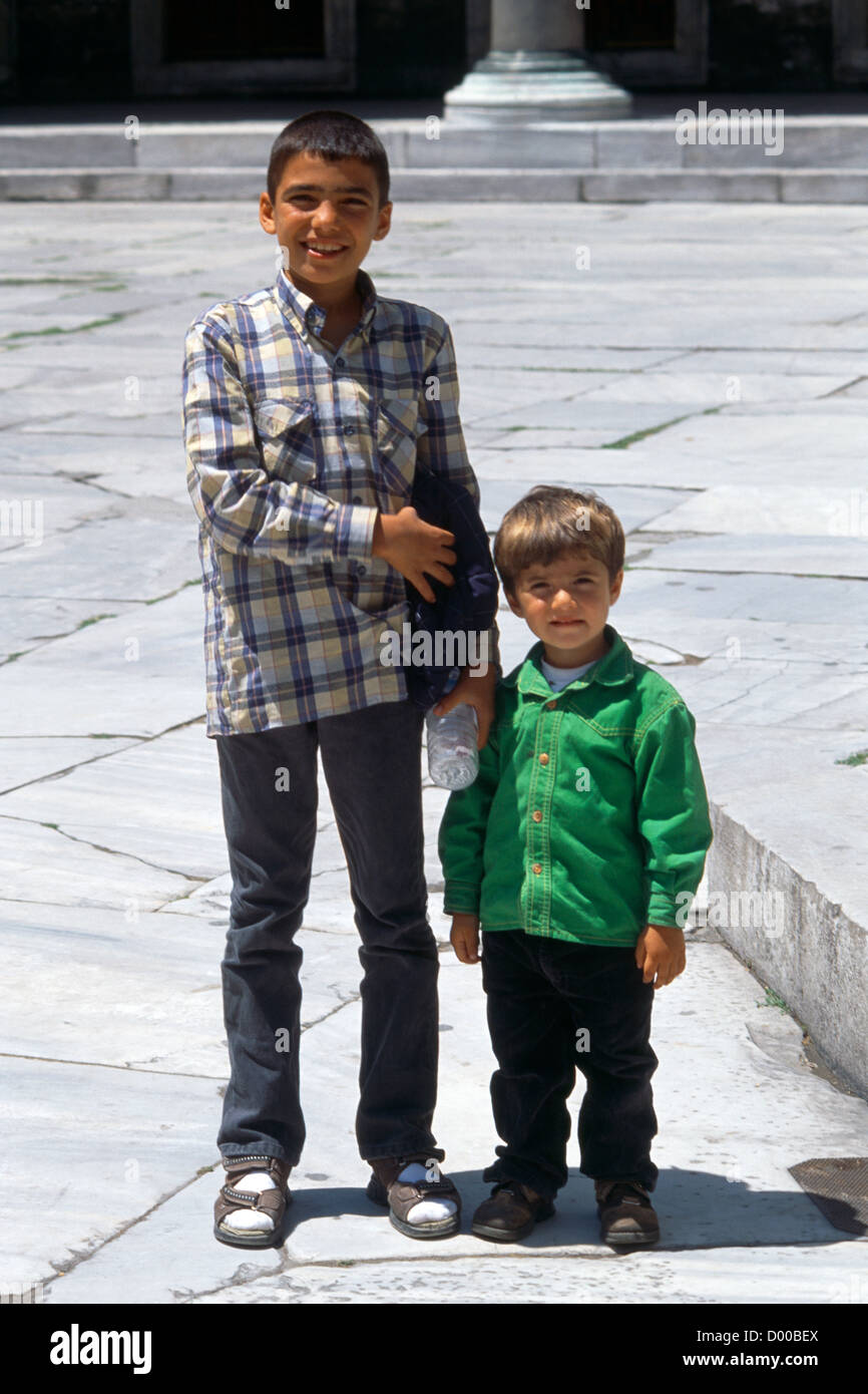 Istanbul Turkey Brothers in Western Dress Outside Blue Mosque Stock