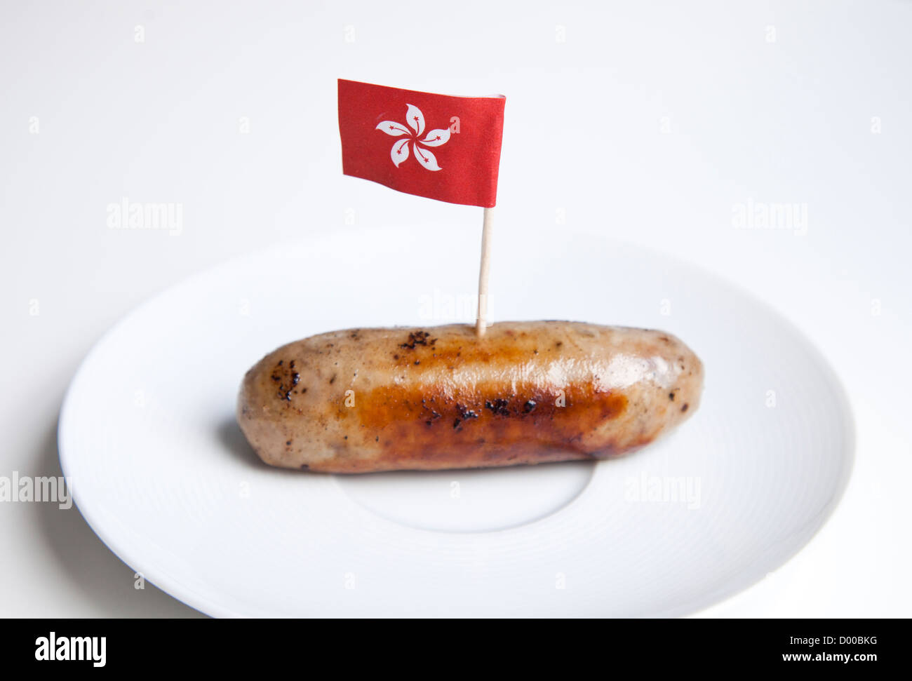 Fried sausage in plate with Hong Kong flag decoration against white background Stock Photo Alamy