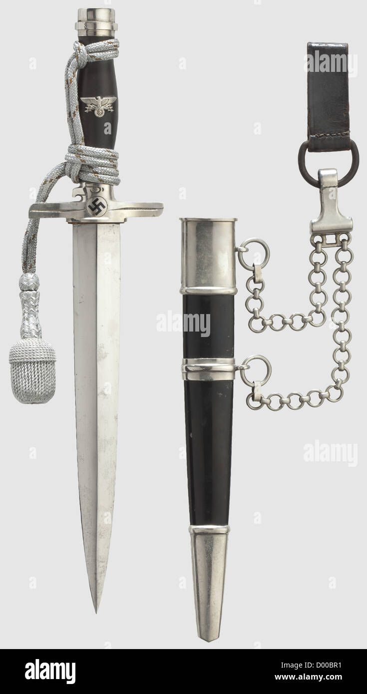 A model 1939 dagger for a leader of the Postal Protection with suspension and portepee,Maker Paul Weyersberg & Co. Solingen The blade bears the maker's logo. The crossguard with the 'DRP' stamp and struck with the number '320'. Black wooden grip with a superimposed emblem. Black lacquered iron scabbard with nickel-plated mountings,complete with the suspension chain. Silver portepee with an orange-coloured interweave. Length 38 cm,historic,historical,1930s,20th century,Reichsbahn,utilities,accessory,accessories,utensil,piece of equipment,utensils,o,Additional-Rights-Clearences-Not Available Stock Photo