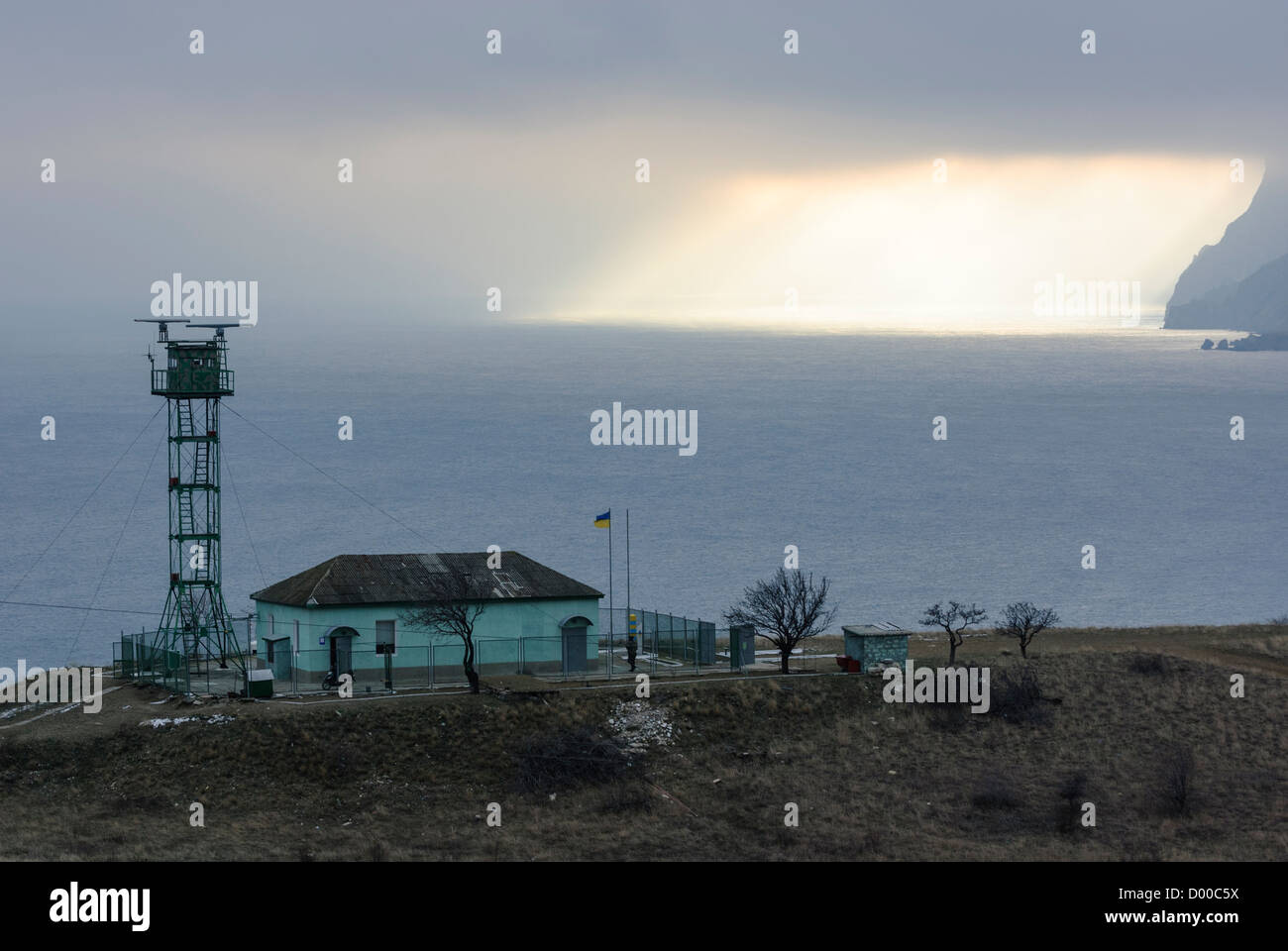 ukraine border outpost guard sea black storm sun godrays ray light ...