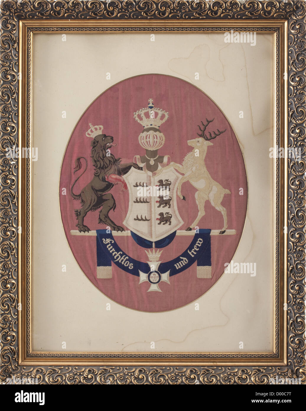 Two sample standard bearings,for the front and the reverse side of the standards for the cavalry 1851 pattern.Coloured woven coat of arms and the crowned cipher 'W' on an amaranth red damask ground(slightly faded),circa 44 x 65 cm.Mounted in an oval passepartout and in a golden plaster frame 63 x 79 cm.This have possibly been sample pieces for the(woven!)standards that have been manufactured by the weaving mill Weigle in Hoheneck near Ludwigsburg in spring 1851(cf.H.Hahn,Feldzeichen des Königlich Württembergischen Heeres,1985,p.81 ff).Very inter,Additional-Rights-Clearences-Not Available Stock Photo