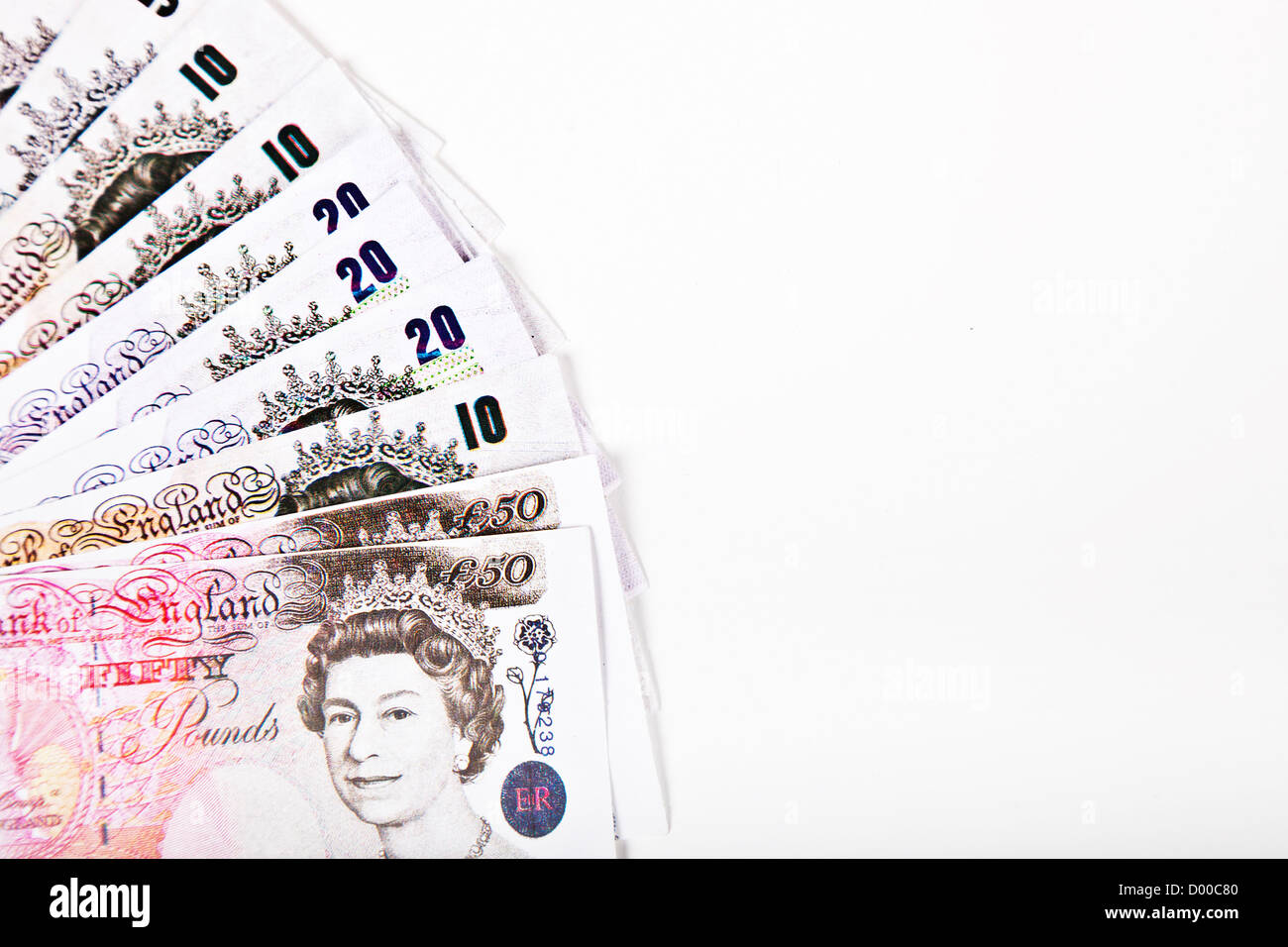 Group of pound notes against white background Stock Photo