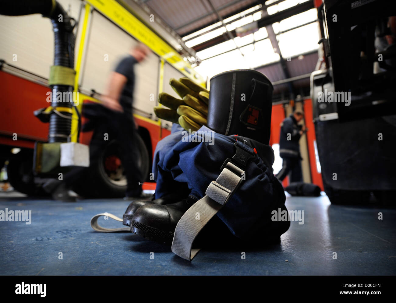 Re. Fireman of white watch at Pontypridd Fire Station in S Wales - fireman's protective gloves boots and over trousers laid out Stock Photo