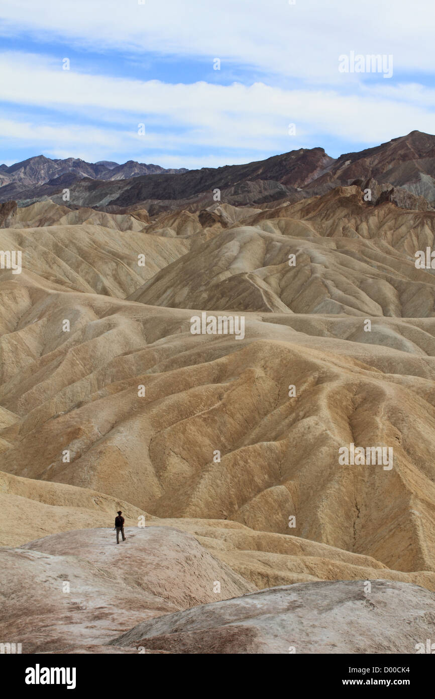 A person looking at the badlands at Zabriskie Point in Death Valley, California, USA Stock Photo