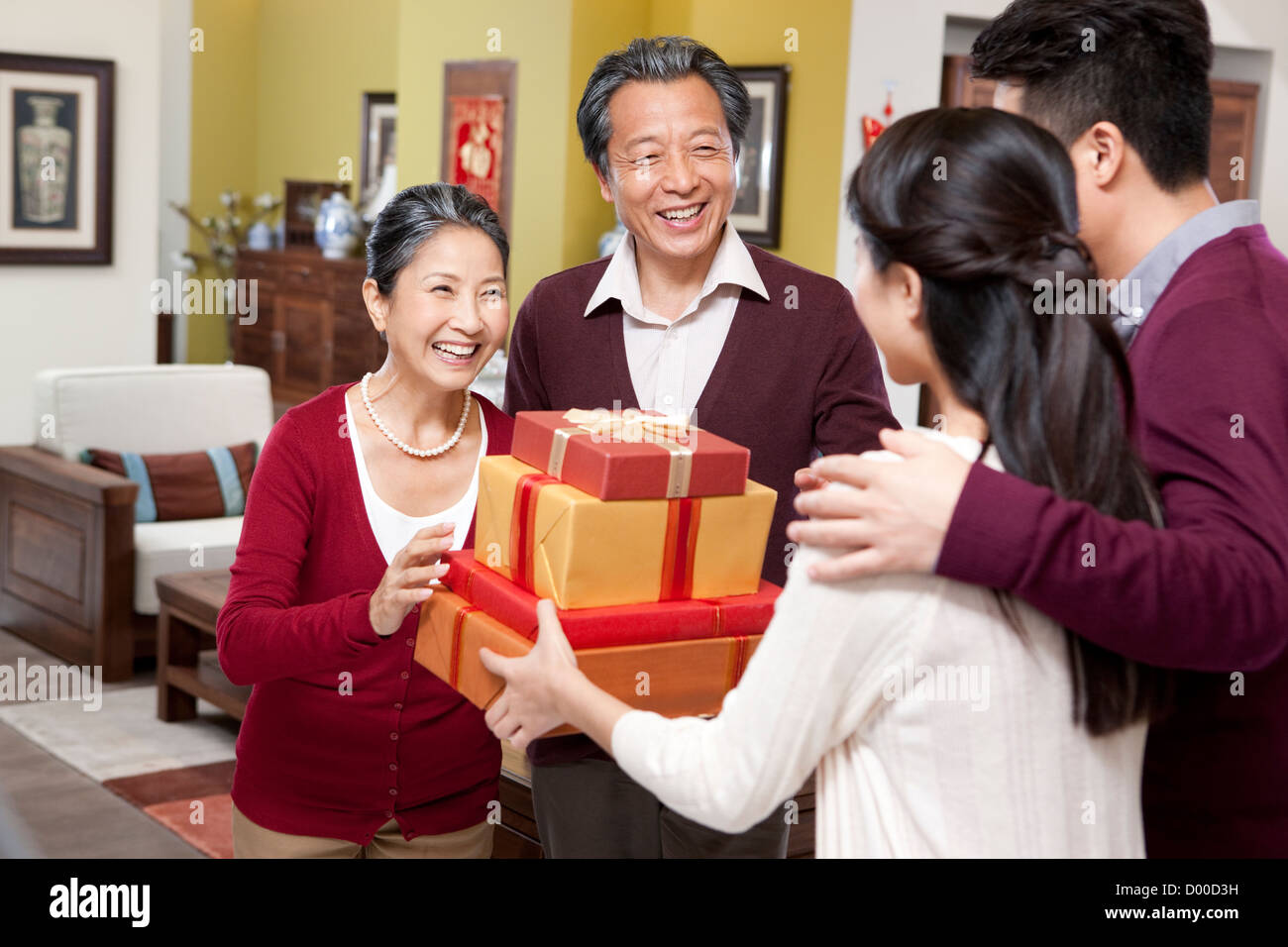 Family visiting with gifts during Chinese New Year Stock Photo Alamy