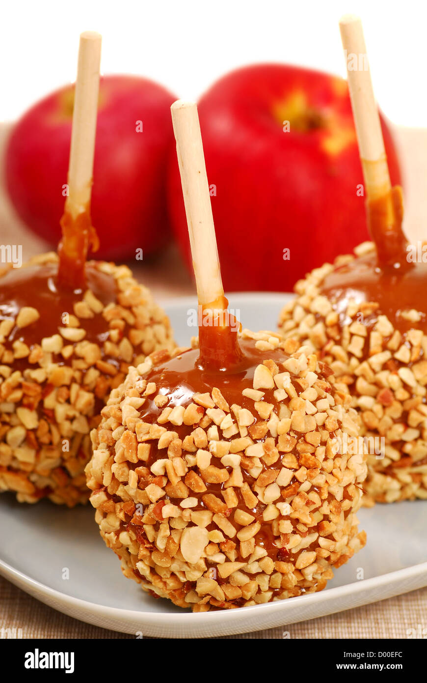 Plate of taffy apples with peanuts ready for Halloween Stock Photo