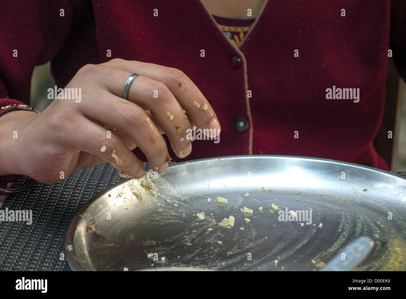 "Eating with hands", "Using hands for eating","Indian food",eating