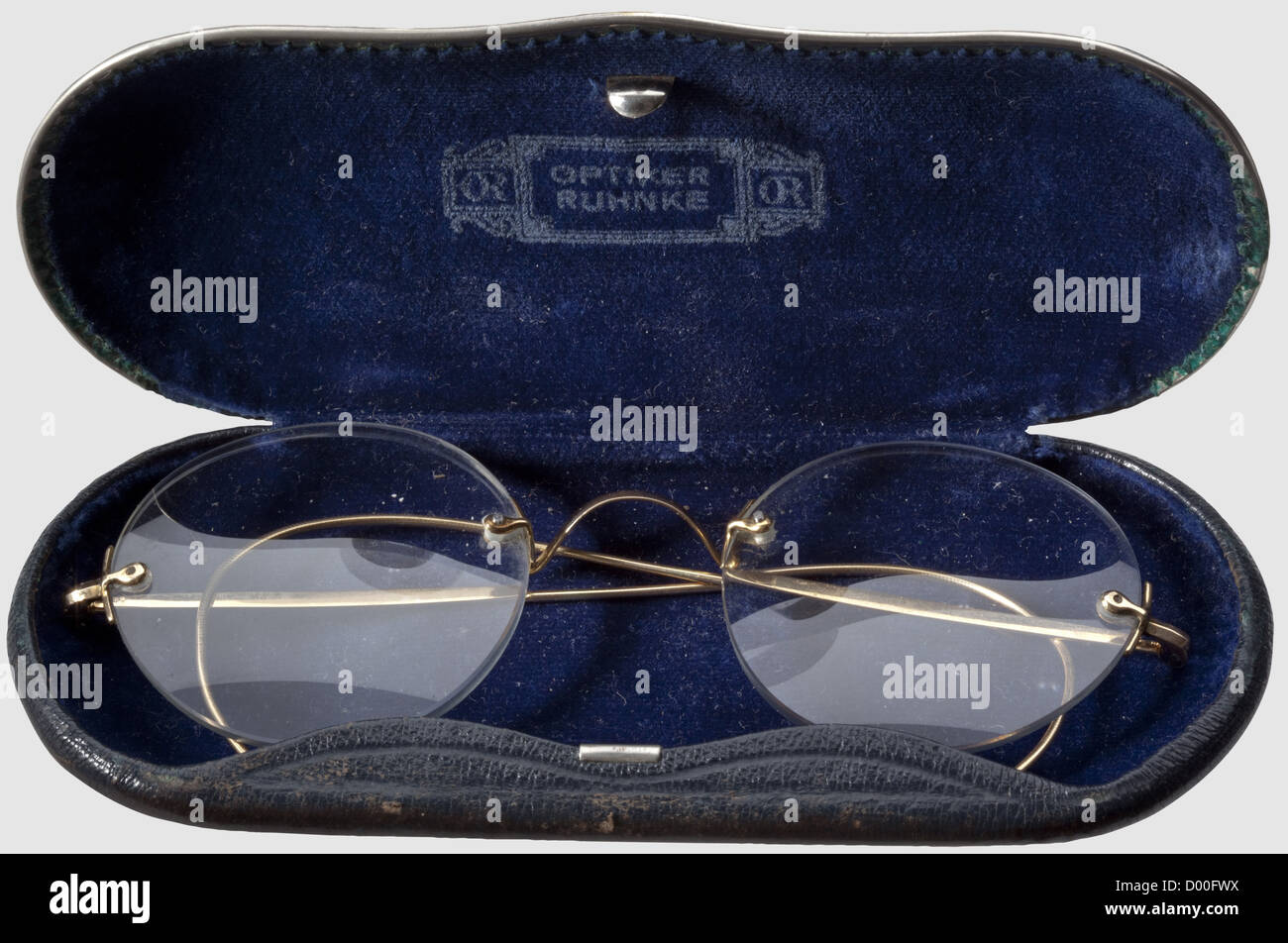Adolf Hitler,reading glasses with gold frame and case Frameless issue,each lense with 2.5 dioptres and mostly free of scratches. The golden temples with hallmarks '585',the bridge(small repair)with an additional mark 'OR' of the Berlin/Hamburg optician Ruhnke. In a shallow,black leather case lined with dark blue velvet and manufacturer's inscription 'Optiker Ruhnke' in the lid. Hitler wore these glasses from about the mid-1920s until the historic,historical,1930s,20th century,NS,National Socialism,Nazism,Third Reich,German Reich,Germany,German,,Additional-Rights-Clearences-Not Available Stock Photo