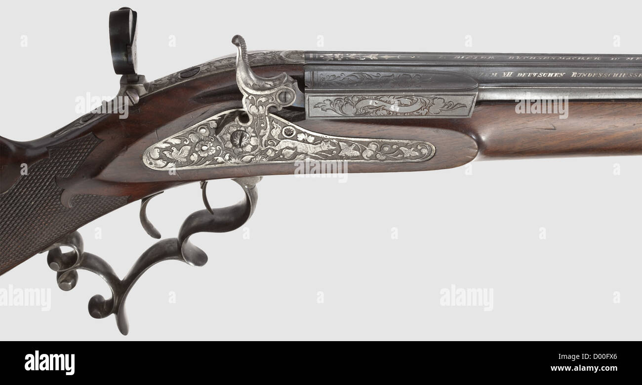 A saloon rifle as prize for the VIIth German Shooting Federation Competition,1881,Court Gunsmith L.Dieter in Munich,1881 Octagonal barrel with a 15 cm long rifled bore,a hooded front sight and an adjustable rear sight,silver floral designs inlaid at the breech,and inscribed 'Ehrengabe gegeben von L.Dieter Büchsenmacher in München zum VII.Deutschen Bundesschiessen.'(Prize donated by L.Dieter Gunsmith in Munich for the VIIth German Shooting Federation Competition).Tang and percussion lock finely decorated with vine work and hunting scenes,with the ye,Additional-Rights-Clearences-Not Available Stock Photo