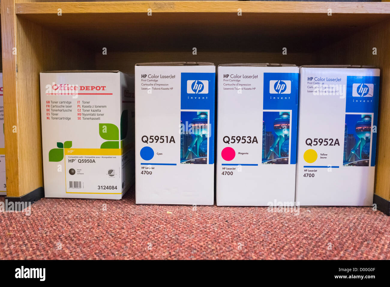 Boxes of HP printer cartridges on an office floor. Stock Photo