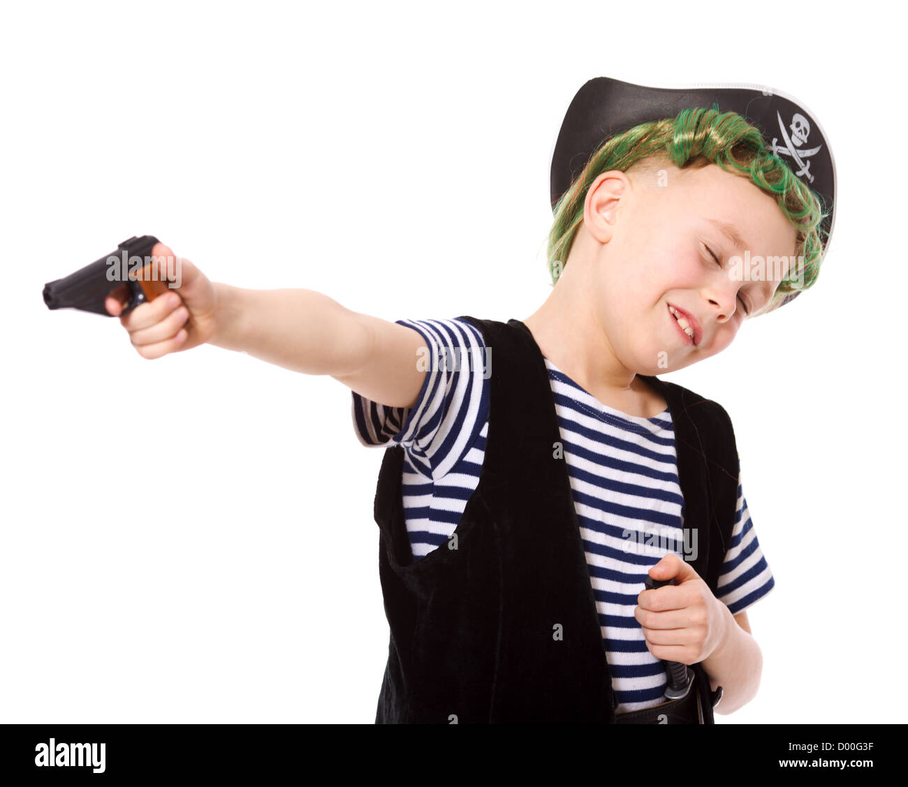 Boy wearing pirate costume shooting pistol isolated on white Stock Photo