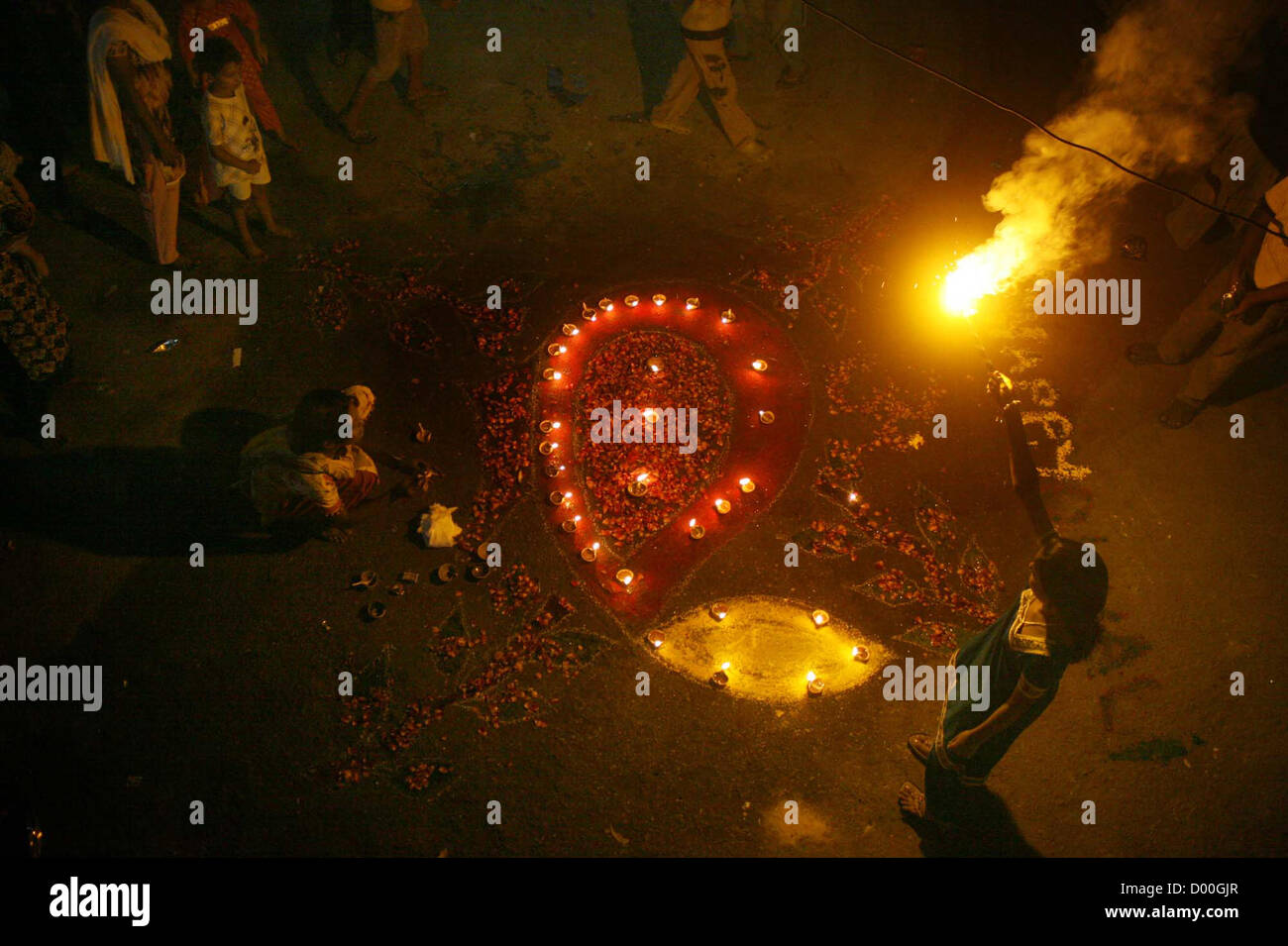 A view of fireworks during ceremony to celebrate the Diwali  festival held Swami Narayan Temple in Karachi on Tuesday, November 13, 2012. The Hindu  community across Pakistan is celebrating their religious festival, Diwali. Members of the Hindu  community lit up oil lamps outside temples, their homes and shops after which pooja ceremonies  were held at the temples. The triumph of good over evil, colorful rangolis (Patterns made by  colors) and firecrackers are the highlights of the Hindu festival. Stock Photo