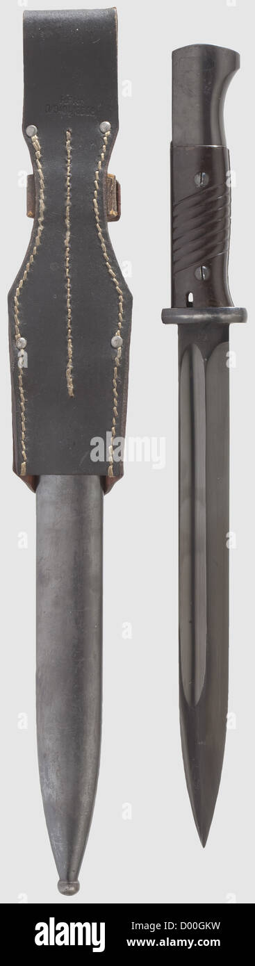 A bayonet 84/98 with frog, Maker ACS, Solingen 3rd Model with police acceptance mark. Originally blued blade with maker's mark, the spine with questionable acceptance mark and 'B'. Blued hilt with Bakelite grip plates. Blued steel scabbard. Black leather frog with RFNr. stamp. Length 38.5 cm, historic, historical, 20th century, thrusting, thrustings, hand weapon, hand weapons, melee weapon, melee weapons, handheld, blade, blades, weapon, arms, weapons, arms, object, objects, stills, clipping, clippings, cut out, cut-out, cut-outs, Additional-Rights-Clearences-Not Available Stock Photo