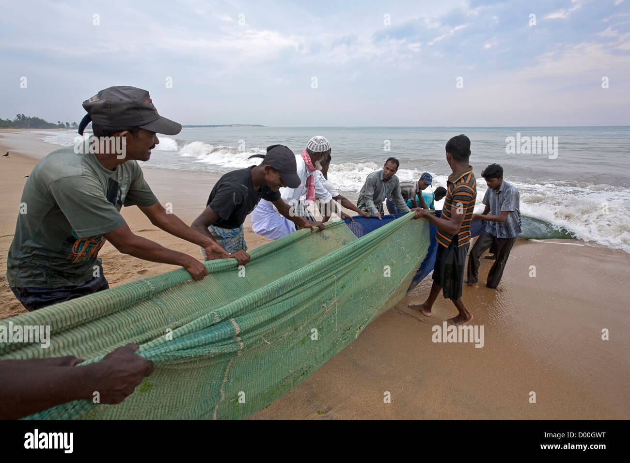 Fishermen pulling the fishing net. Arugam Bay. Sri Lanka Stock Photo