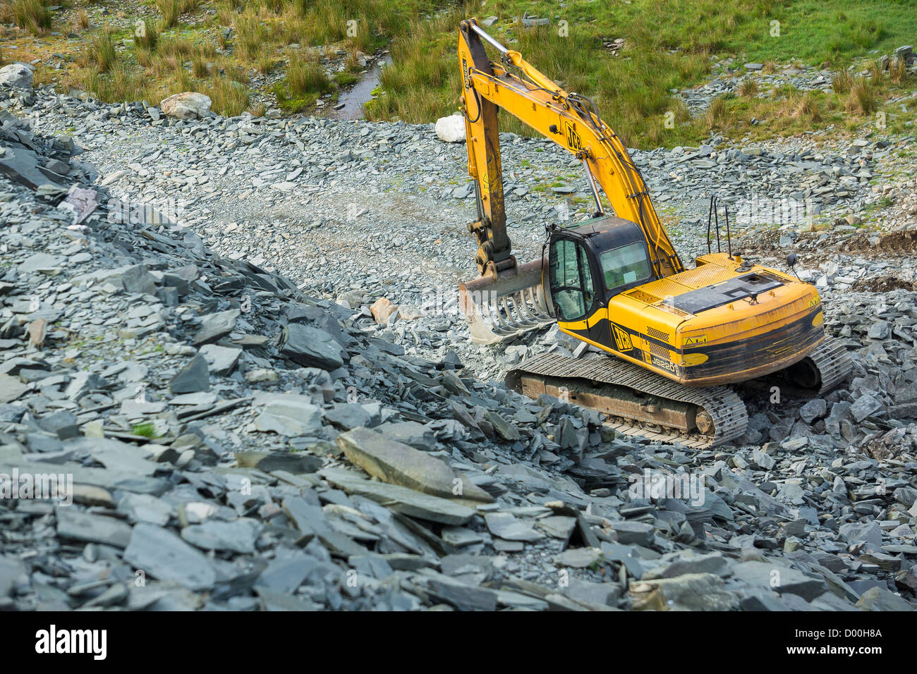 A large JCB digger at Honister Slate Mine in the Lake District. Stock Photo