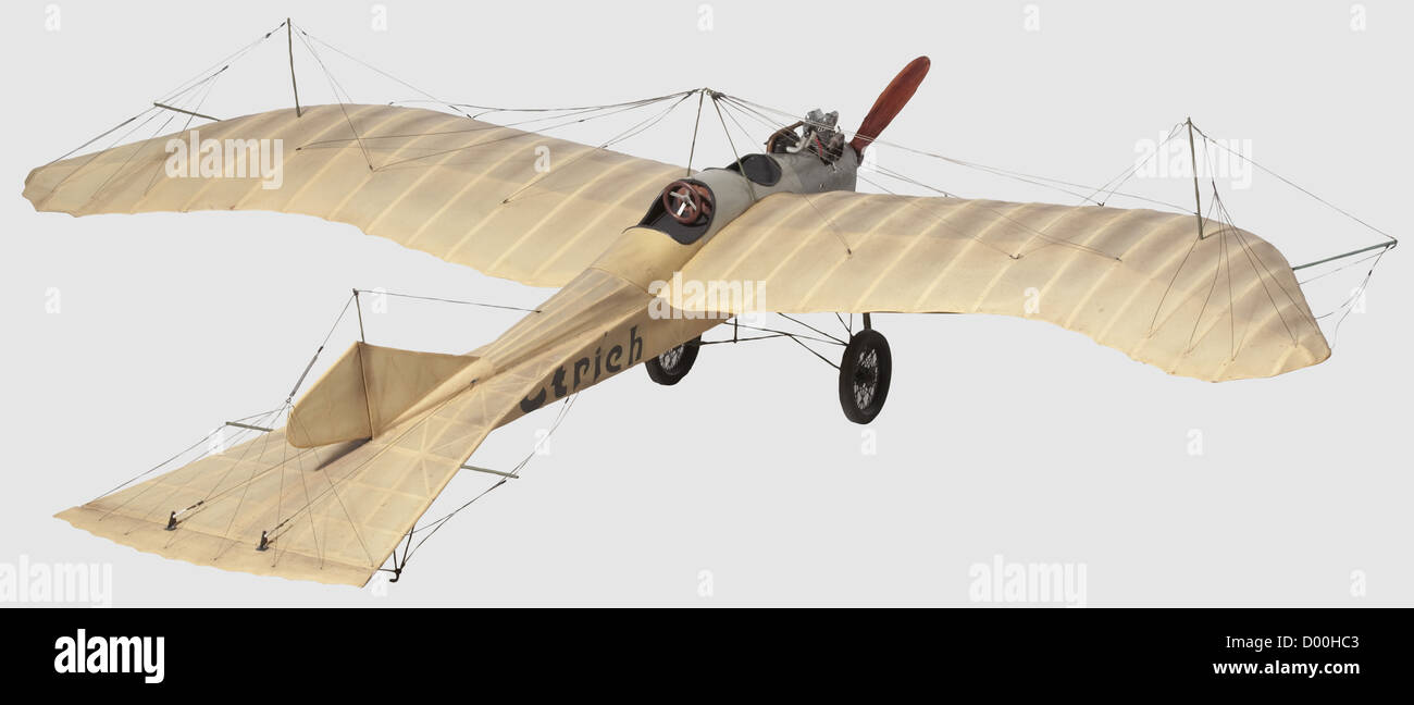 An Etrich 'Taube'(Dove),A flying scale model of this famous World War One fighter monoplane,the balsa-wood airframe covered and finished in natural doped fabric with wing warping mechanism to the main-planes with supporting pylons,movable rudder and elevator,the underside of the main-planes painted in black with the Etrich logo,the forward fuselage with dummy lateral radiators,the rear cockpit with control wheel,the dummy 100 h.p.Argus engine mounted together with a 4-stroke miniature petrol engine driving a two-blade 43 cm diameter propeller,on strut,Additional-Rights-Clearences-Not Available Stock Photo