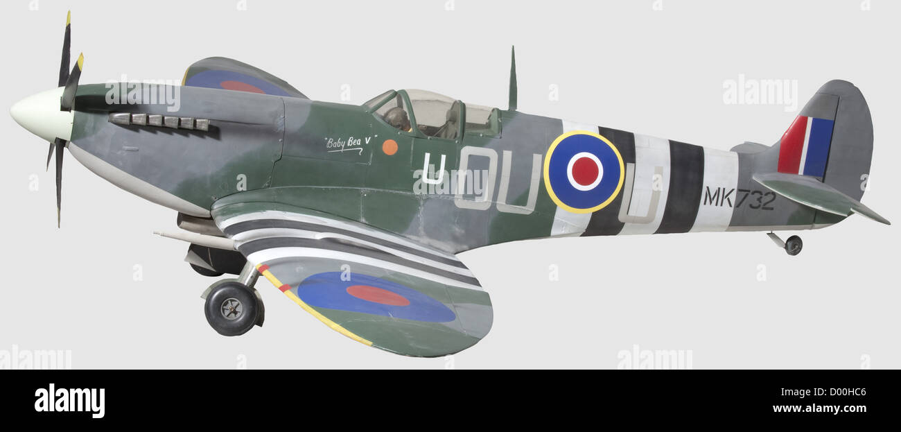 A Supermarine 'Spitfire',A well-built flying scale model of 'Spitfire' Mk.IX MK 732 OU - U,finished in Royal Air Force livery of the 1944 invasion period,with dummy 20 mm,wing-mounted guns,cockpit detail includes model pilot,some instrumentation and glazed canopy,the cockpit side inscribed 'Baby Bea V' with crimson disc and letter 'U',with exhaust stacks and dummy non-scale four-blade 50 cm diam. propeller,on retractable undercarriage with rubber tyred main and tail wheels,228 cm wingspan,historic,historical,1930s,20th century,object,objects,st,Additional-Rights-Clearences-Not Available Stock Photo