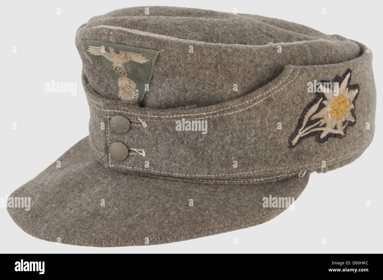 A peaked cap for leaders of mountain troops,of field grey woolen material with silver piping and field grey metal buttons,light linen liner(faded). BeVo national badge in trapezoid shape,silver-grey weave on a field grey background. Machine-embroidered Edelweiss,historic,historical,1930s,1930s,20th century,Waffen-SS,armed division of the SS,armed service,armed services,NS,National Socialism,Nazism,Third Reich,German Reich,Germany,military,militaria,utensil,piece of equipment,utensils,object,objects,stills,clipping,clippings,cut out,Additional-Rights-Clearences-Not Available Stock Photo
