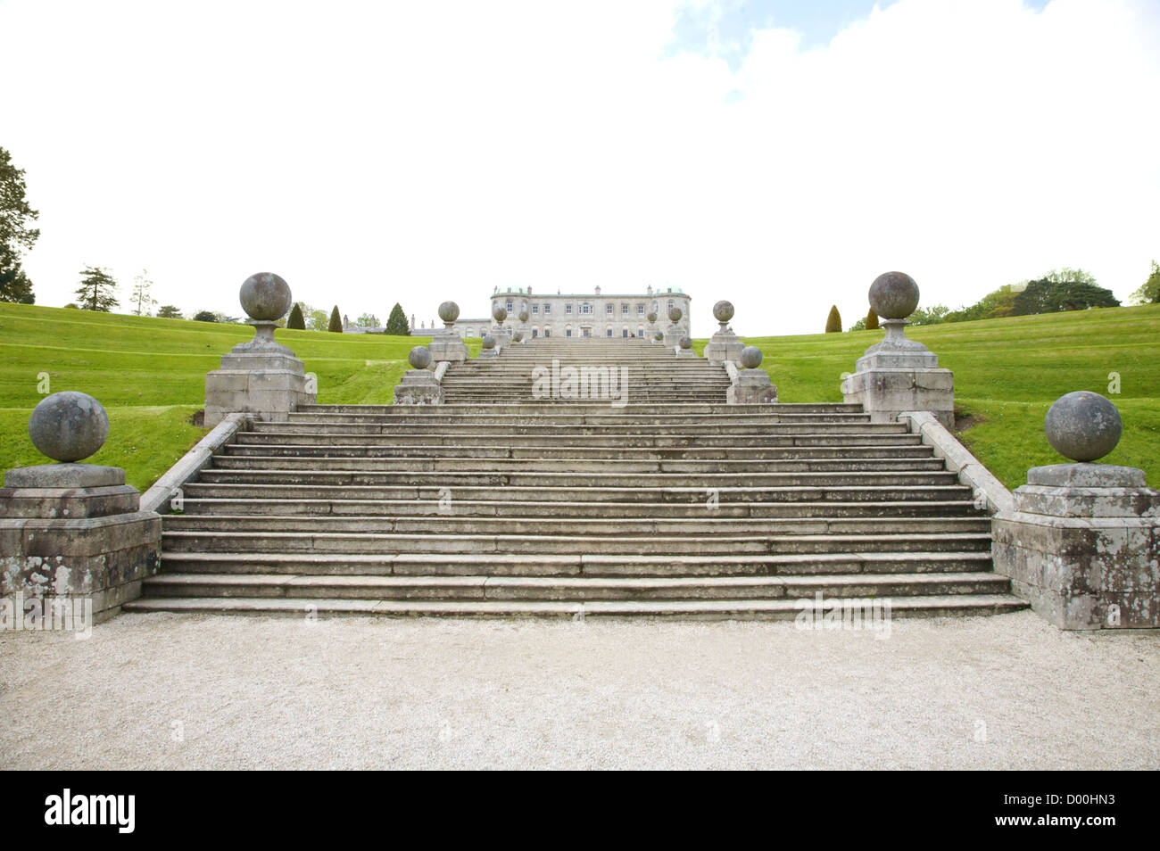 big stone stairs with sculptures and garden Stock Photo