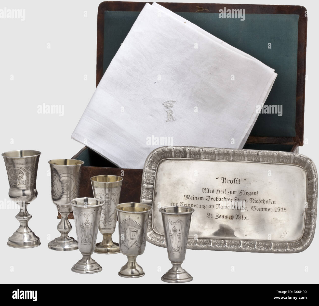 Manfred Freiherr von Richthofen(1892 - 1918),the most successful fighter pilot of World War I,Knight of the Order Pour le mérite. A Russian Schnapps Set. Engraved silver,Russia,1877 - 1900. The set consists of six vodka beakers,a tray,a napkin,and a box. Various Russian makers' marks are present,like 'G.R.','S.I.' and 'P.T.',with fineness marks for '84' zolotniki. Two of the beakers(gilt interior)engraved with the coat of arms of the von Richthofen family,one of which bears the inscription ''Franz' in Russland,Feldflieger Abt. 69. Juli 1915'('Fr,Additional-Rights-Clearences-Not Available Stock Photo