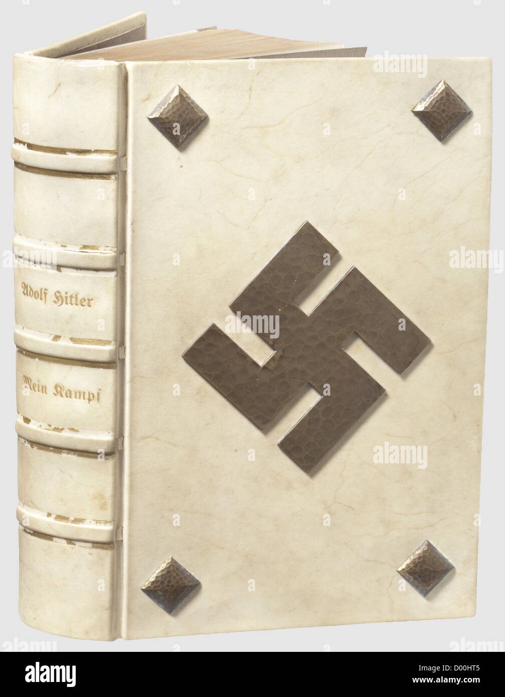 Jacques Buser-Kobler(BUKO)- a deluxe 'Mein Kampf' edition with Hitler dedication to NSDAP-Ortsgruppe Basel 1935,Combined 1934 edition with gold-edged pages and parchment cover with applied,hammered brass decorative nails as well as obverse swastika,the spine stamped in gold.On the inner cover an ex libris(bookplate)'Büchersammlung der National Sozialist.Deutschen Arbeiter Partei Ortsgruppe Basel',signed 'BUKO'.On the flyleaf a hand-written dedication by Hitler 'Den Parteigenossen der N.S.D.A.P.-Ortsgruppe Basel herzlichst zugeeignet - Adolf Hitler - ,Additional-Rights-Clearences-Not Available Stock Photo
