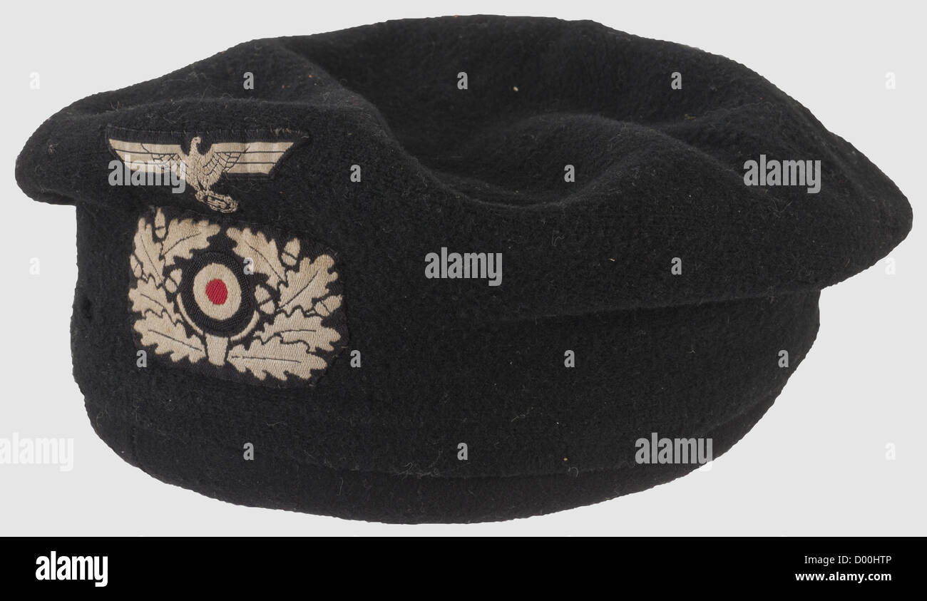 A beret for the special purpose uniform of Panzer troops,Black wool material with machine-woven BeVo insignia(white on black backing),moth damage. The body(pushed in)with black wool felt cover(old tear)with six sealed black rubber grommets for ventilation,in the centre a woven label 'Carl Halfar Berlin N20 Prinzenallee 74',brown leather sweat band(light damage),historic,historical,1930s,1930s,20th century,armoured corps,armored corps,tank force,tank forces,branch of service,branches of service,armed service,armed services,military,milit,Additional-Rights-Clearences-Not Available Stock Photo