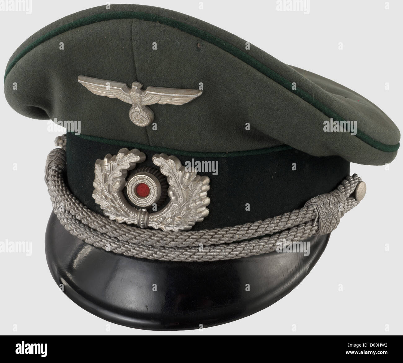 A visor cap for officers,of fine field-grey wool with dark green lace band and dark green piping,aluminium insignia and silver cap cording(damaged). Black silk liner,grey leather sweat band,maker's label 'Meister-Klasse CW' with gold stamping and wearer's tag 'Oberzahlmeister Willy Lehner Nr. 08797A.' Defects and moth traces,historic,historical,1930s,1930s,20th century,army,armies,armed forces,military,militaria,object,objects,stills,clipping,clippings,cut out,cut-out,cut-outs,uniform,uniforms,clothes,piece of clothing,headpiece,hea,Additional-Rights-Clearences-Not Available Stock Photo