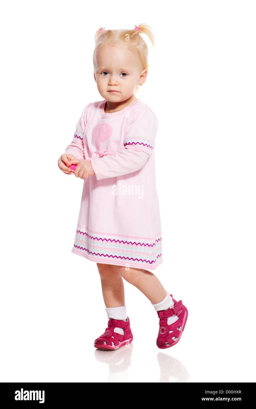 Little girl wearing pink dress isolated on white Stock Photo - Alamy