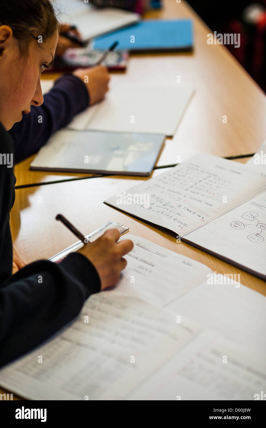 A Teenage girl in a mathematics class at a secondary comprehensive school, Wales UK Stock Photo