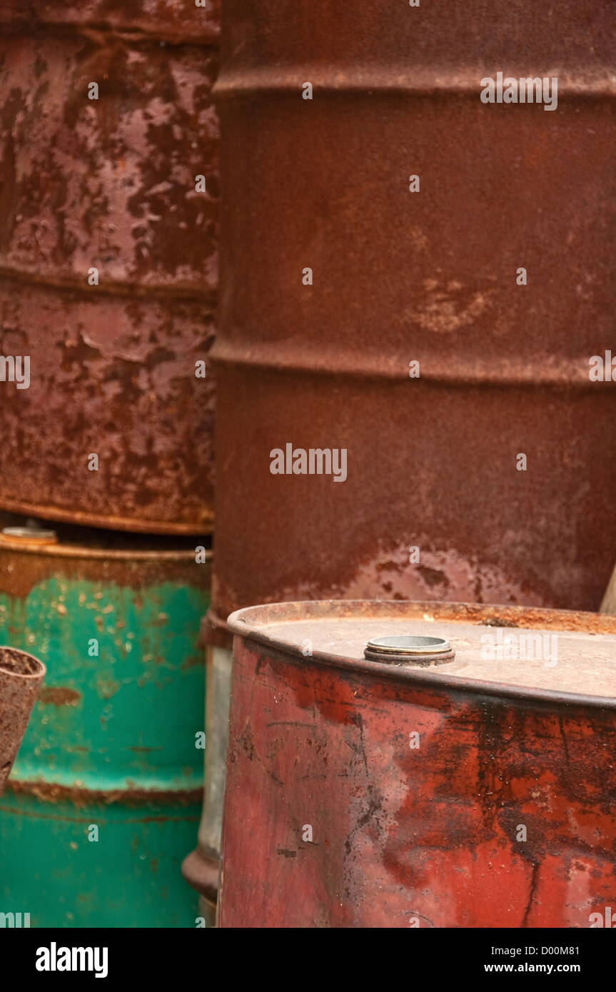 Rusty fuel and chemical drums, corroded barrel pile. Stock Photo