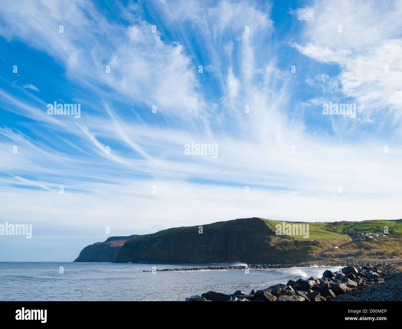 Weather system high level Jet Stream Cirrus clouds or Mare's tails over the English East coast at Skinningrove North Yorkshire Stock Photo