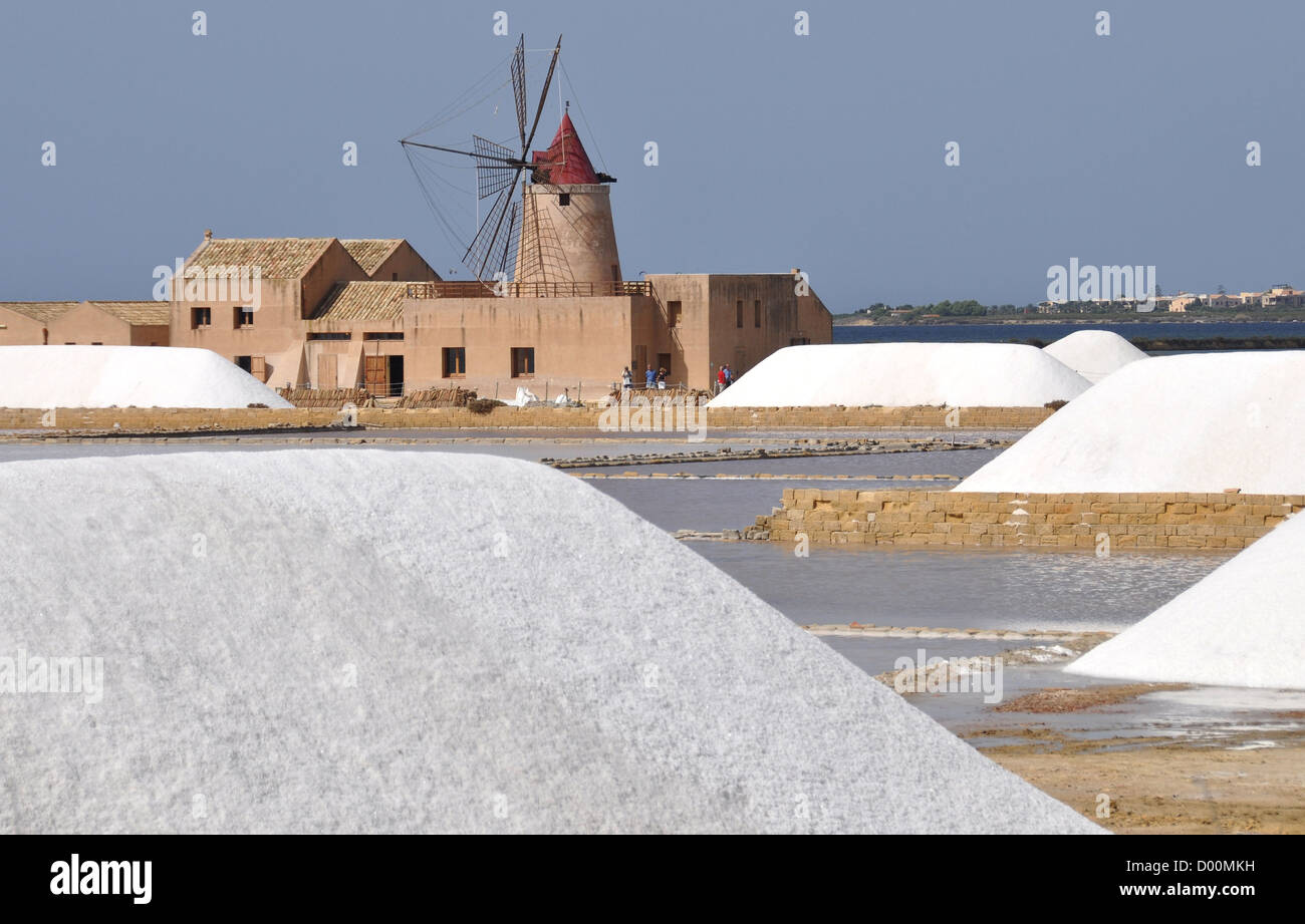 Windmill and salt pans between Trapani and Marsala, Sicily, Italy Stock Photo
