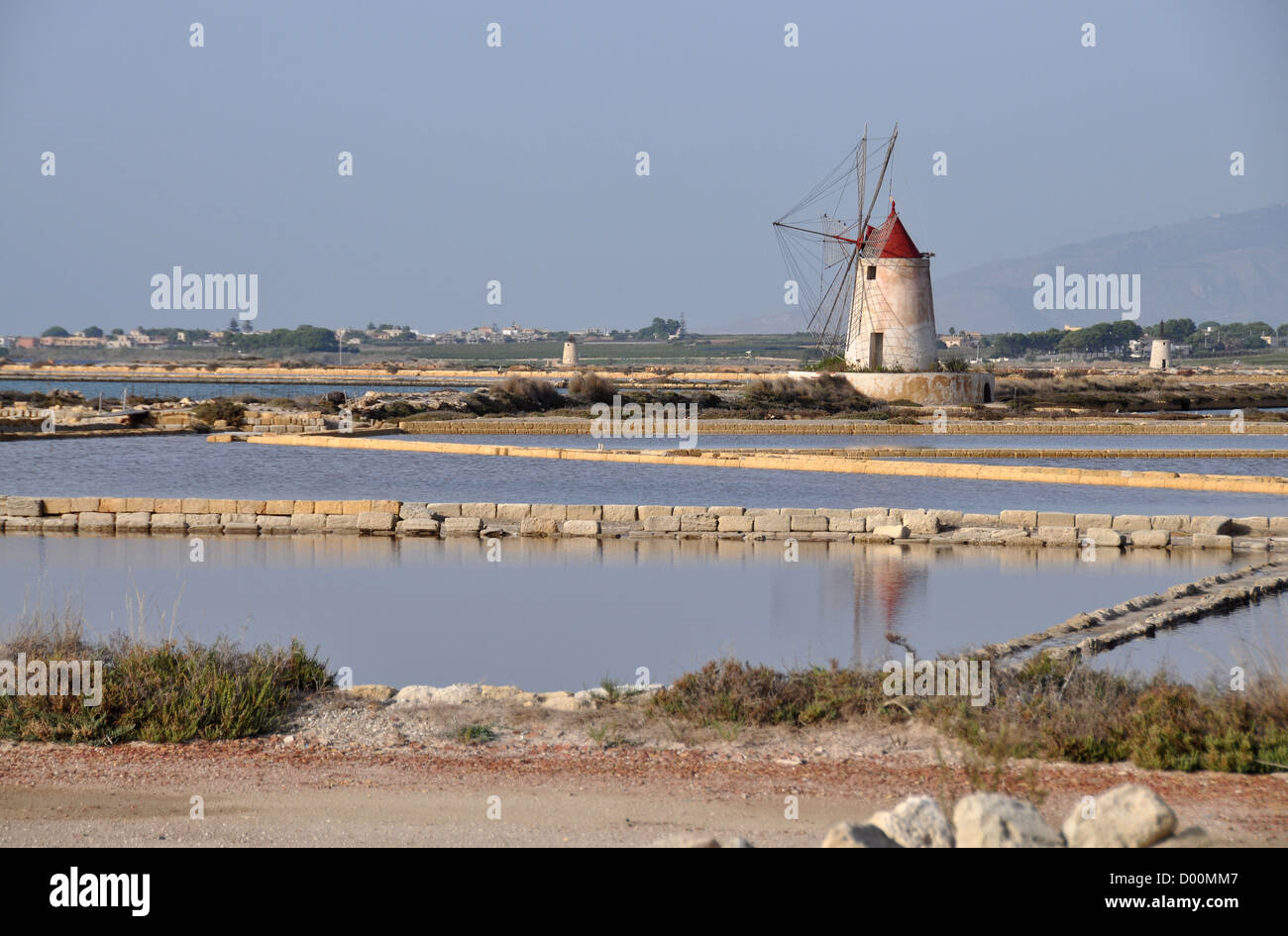 Salt pans and windmill, Trapani, Marsala, Sicily, Italy Stock Photo