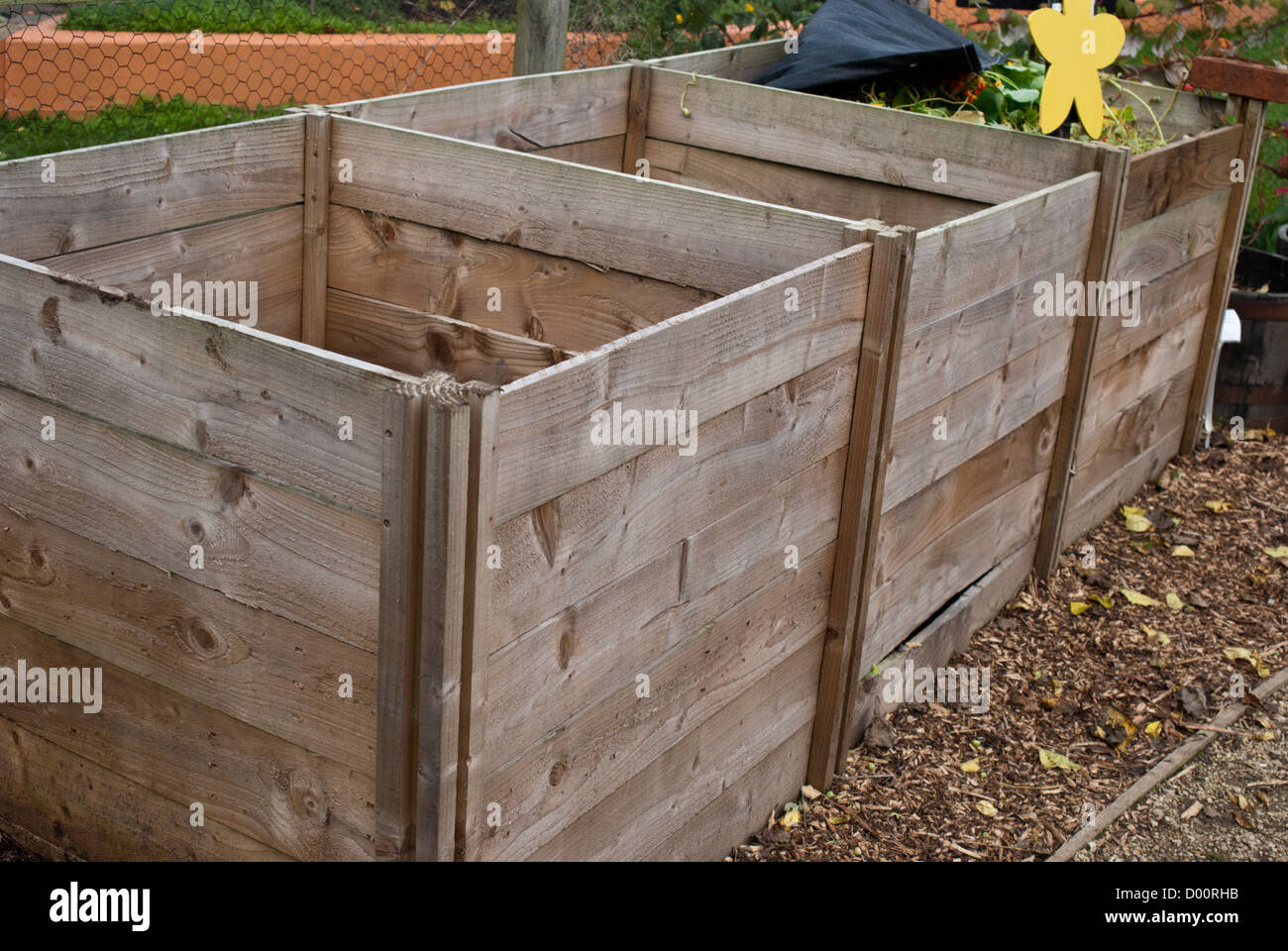 A wooden three bay compost bin Stock Photo