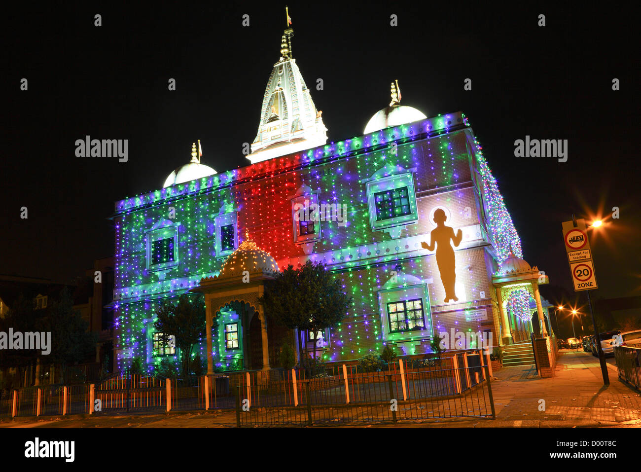 The Shree Swaminarayan Temple, seen here festooned with bright coloured lights celebrating Dawali. Stock Photo