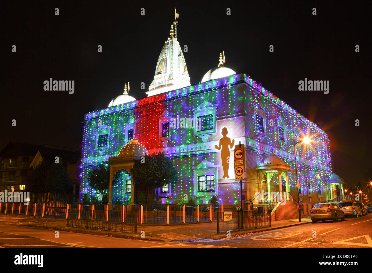 The Shree Swaminarayan Temple, seen here festooned with bright coloured lights celebrating Dawali. Stock Photo