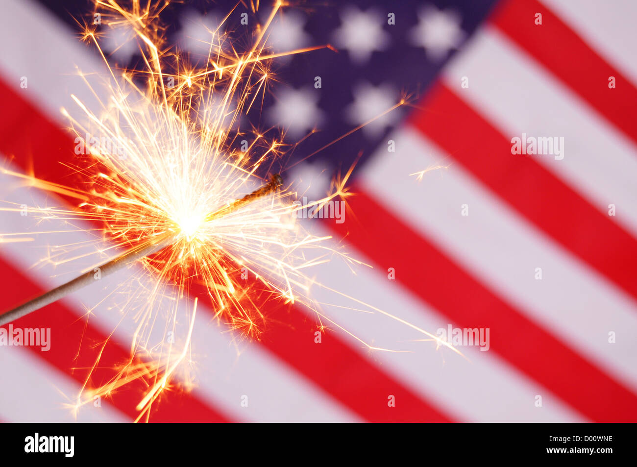 sparkler and usa flag showing 4th of july Stock Photo - Alamy