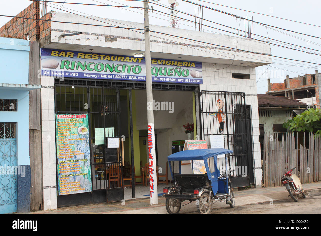 Restaurant in Peru with Moto taxi in front Stock Photo