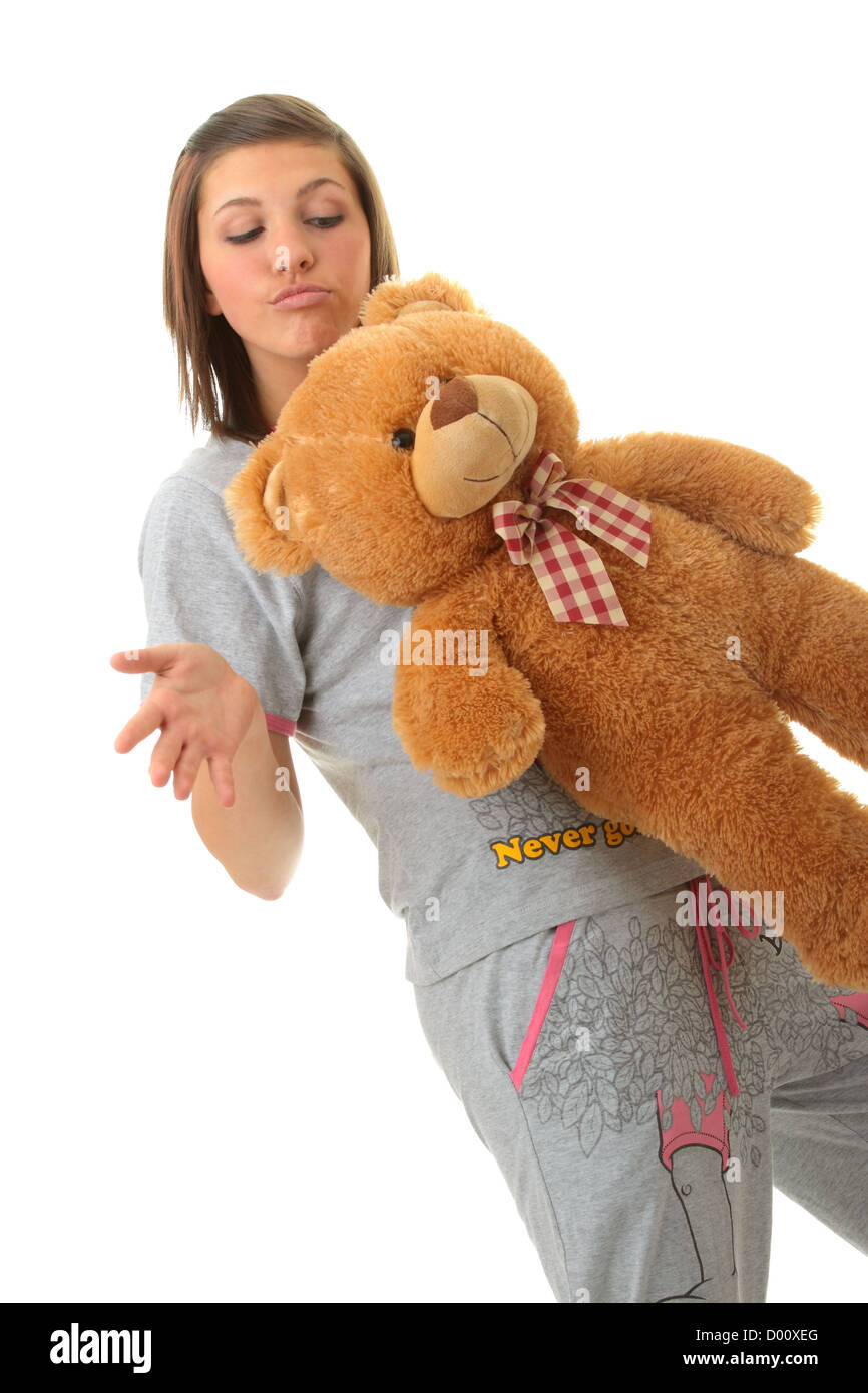 Beautiful teenager holding a teddy bear - isolated on white background ...