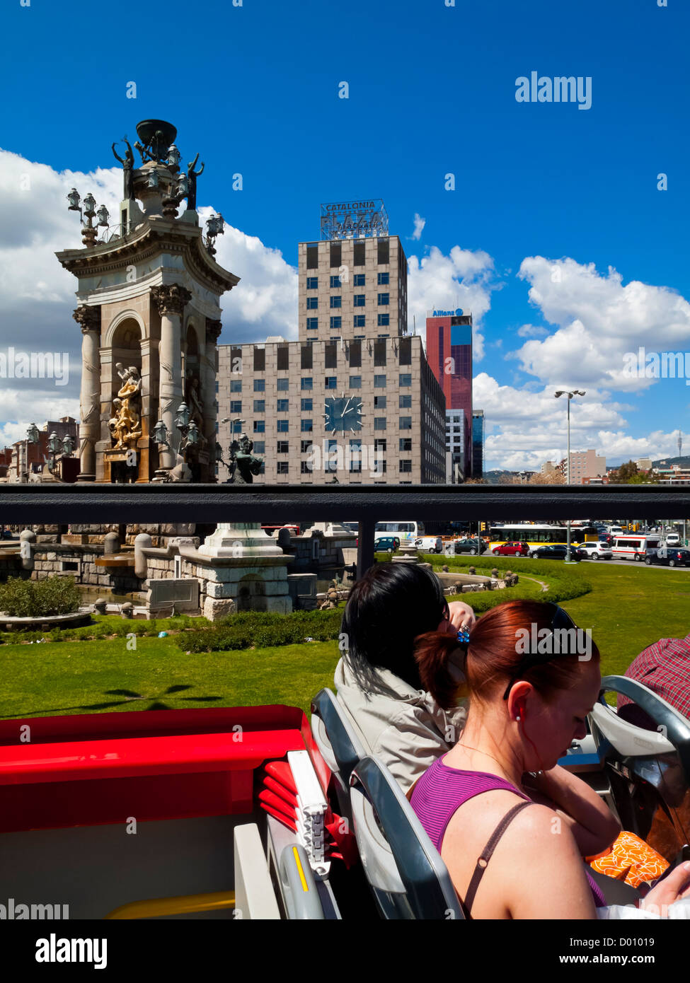 Tourists on an open top double decker sightseeing bus in Barcelona city centre Catalonia Spain Stock Photo