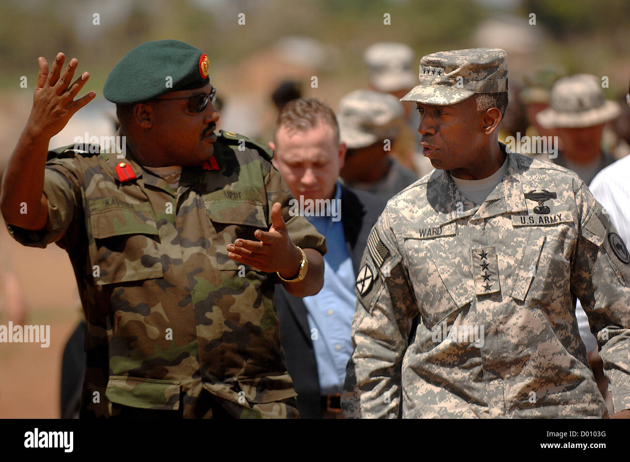 US Army General William Kip Ward,  Commander of US Africa Command talks with Ugandan People's Defense Force Col. Sam Kavuma while touring the Gulu district of Uganda April 10, 2008. Defense Secretary Leon Panetta has demoted Ward November 13, 2012 accused of spending thousands of dollars on lavish travel and other unauthorized expenses Stock Photo