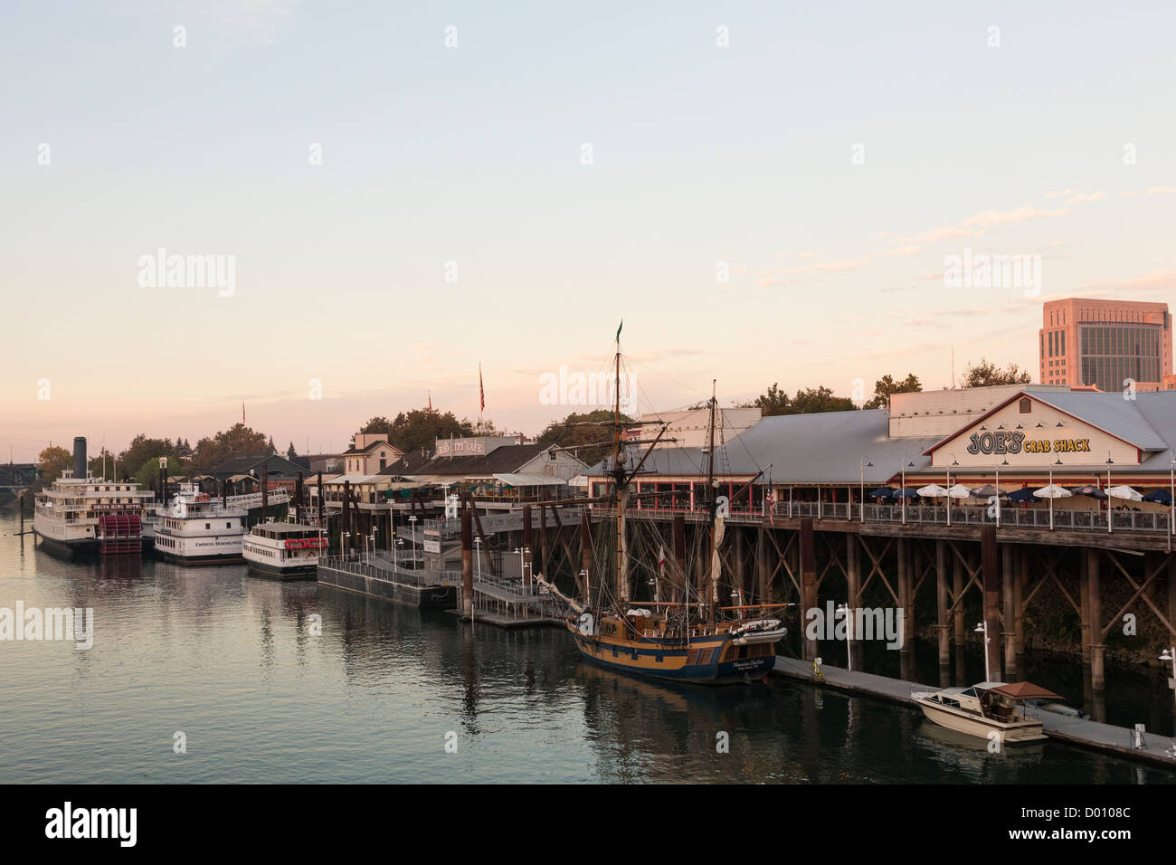Old Sacramento waterfront after sunset Stock Photo