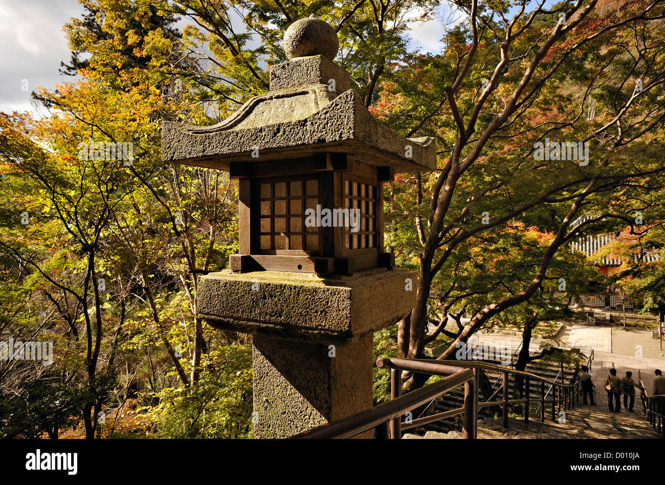 Stone lantern in the garden at Hasedera shrine at Hase near Nara, Japan Stock Photo